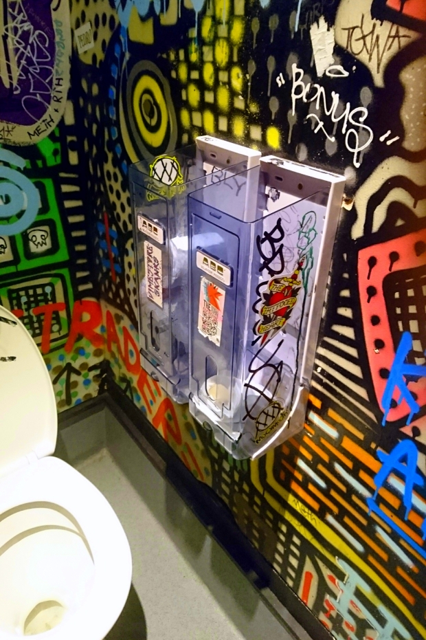 Kings Arms men's toilet interior, stall paper holder